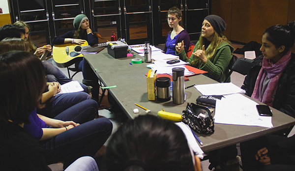 Valerie and youth at a script writing workshop